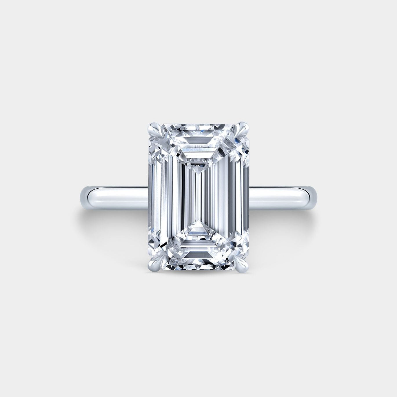 Emerald Diamond Hidden Halo Solitaire Platinum Engagement Ring