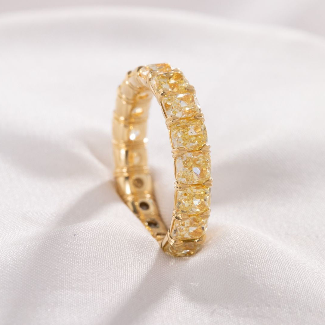 5.5ct Cushion Cut Fancy Yellow Diamond Eternity Band in 18k yellow gold