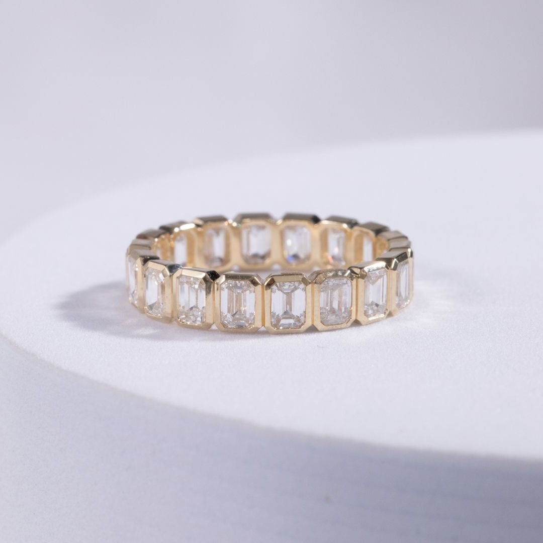 2.75ct Emerald Cut Diamond Bezel Set Yellow Gold Eternity Band in 14k yellow gold